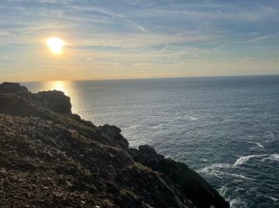 Image of sun setting on the coastal path in Cornwall